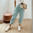 Lightweight FJØRNA women's wide-leg summer trousers with striped pattern and side pockets, breathable and comfortable for warm weather.