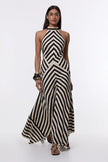 FJØRNA Mono Fluid Stripe Maxi Halter Dress with bold horizontal stripes and a flowing silhouette, perfect for summer occasions.