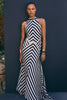 FJØRNA Mono Fluid Stripe Maxi Halter Dress displayed on a model, featuring bold horizontal stripes and a flowing maxi silhouette.