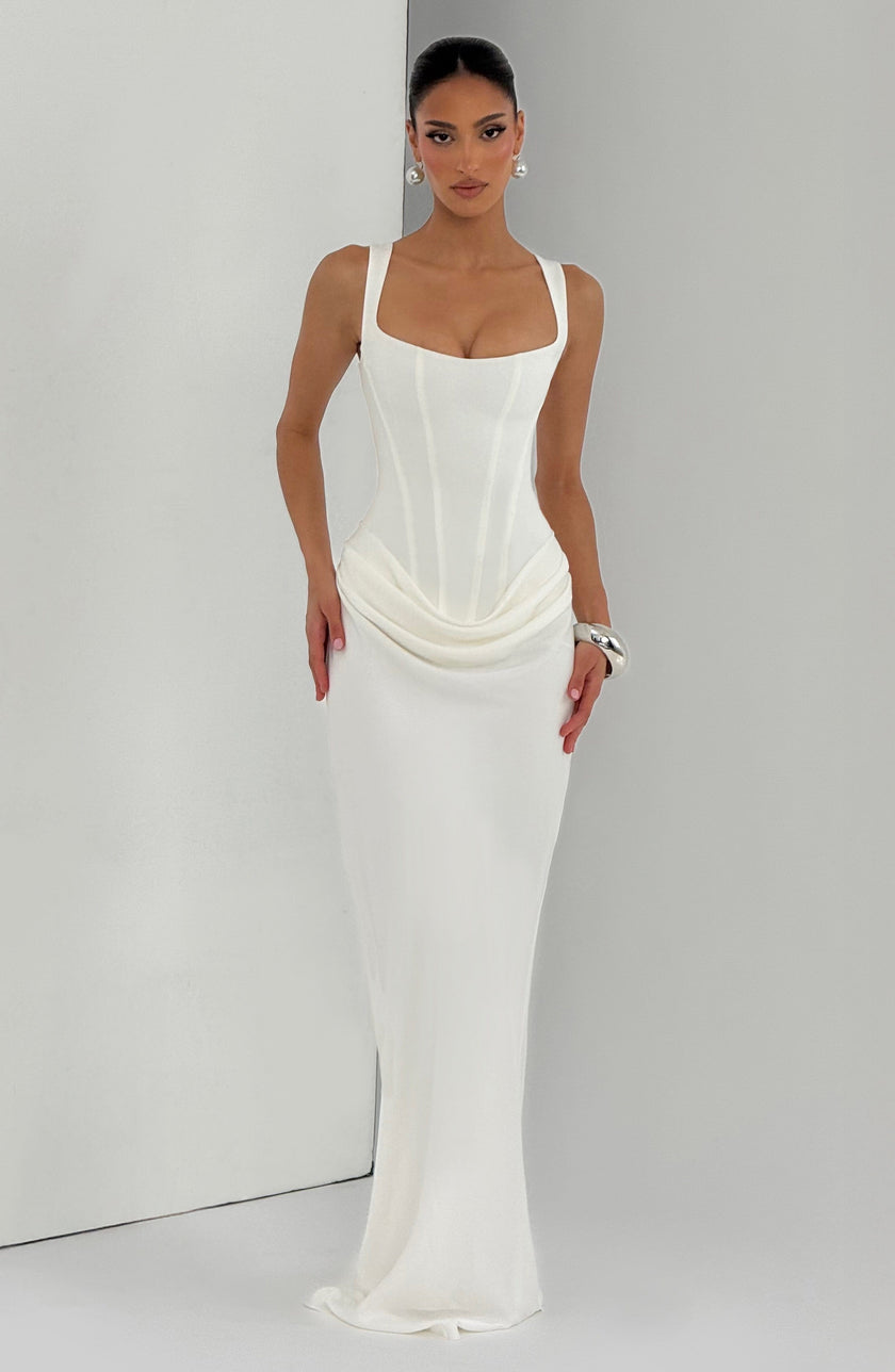 Women’s ivory summer maxi dress by FJØRNA with square neckline and fitted bodycon style, showcased on a model.
