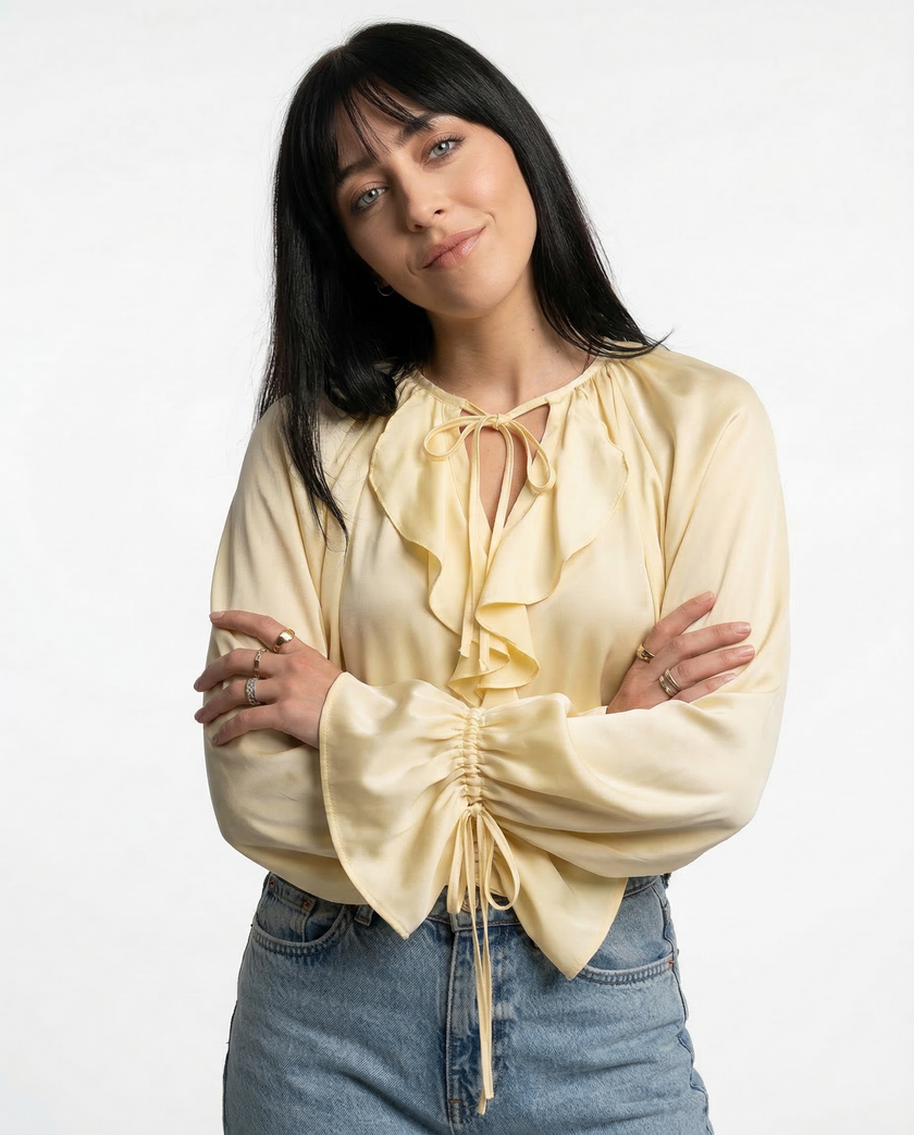 FJØRNA satin blouse for women with ruffle detail, stylish women's top featuring smooth fabric and elegant design.