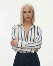 FJØRNA satin blouse for women, stylish top with smooth fabric and elegant design, shown in a flattering fit.