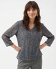 FJØRNA linen blend blouse for women with long sleeves, featuring a relaxed fit and natural fabric texture.