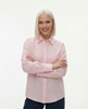 FJØRNA women's long sleeve linen blouse, lightweight and breathable, shown on a model with a relaxed fit and natural fabric texture.