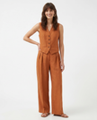 FJØRNA women's linen wide-leg trousers, part of co-ord set, featuring relaxed fit and lightweight fabric for casual style.