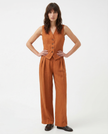 FJØRNA women's linen wide-leg trousers in a stylish co-ord set, showing the relaxed fit and natural fabric texture.