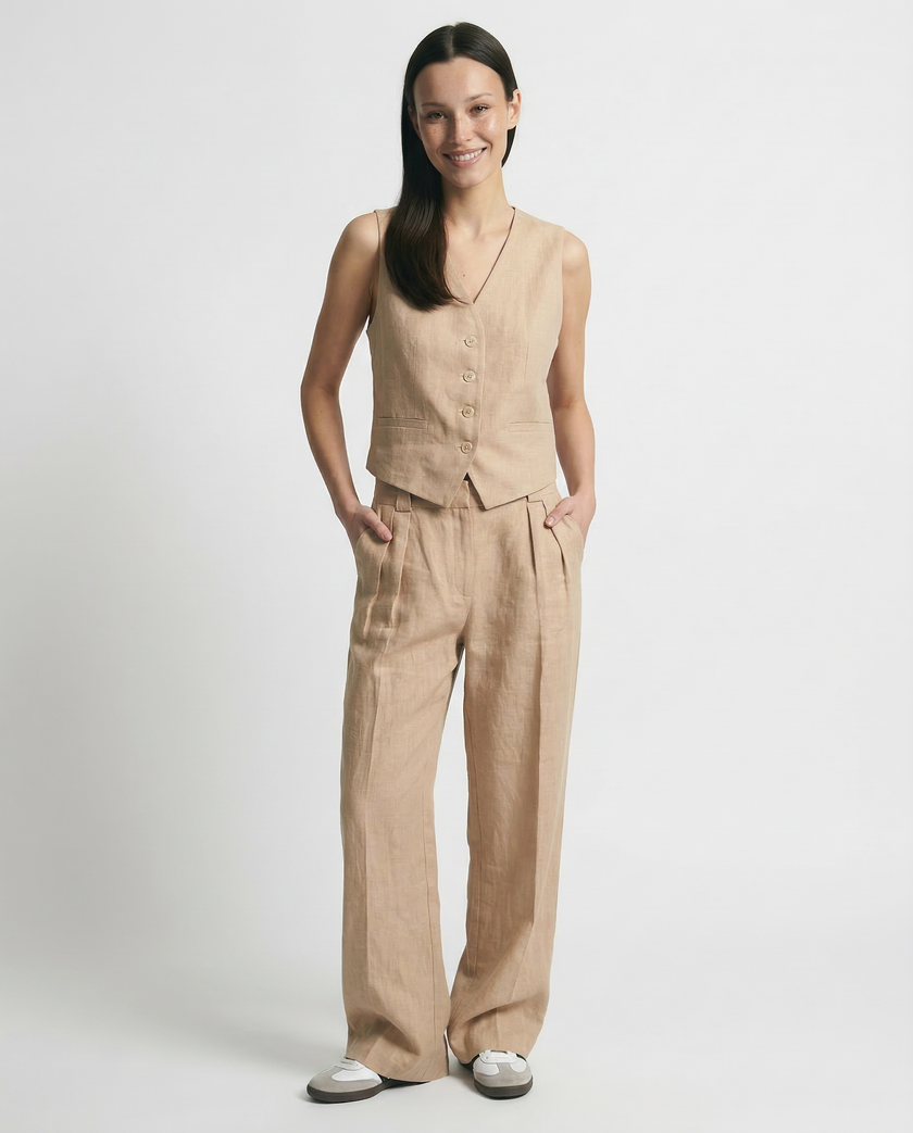 FJØRNA women's linen wide-leg trousers from co-ord set, featuring relaxed fit and lightweight, breathable fabric.