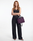 FJØRNA linen wide-leg women's trousers from a co-ord set, with a relaxed fit and natural fabric texture.