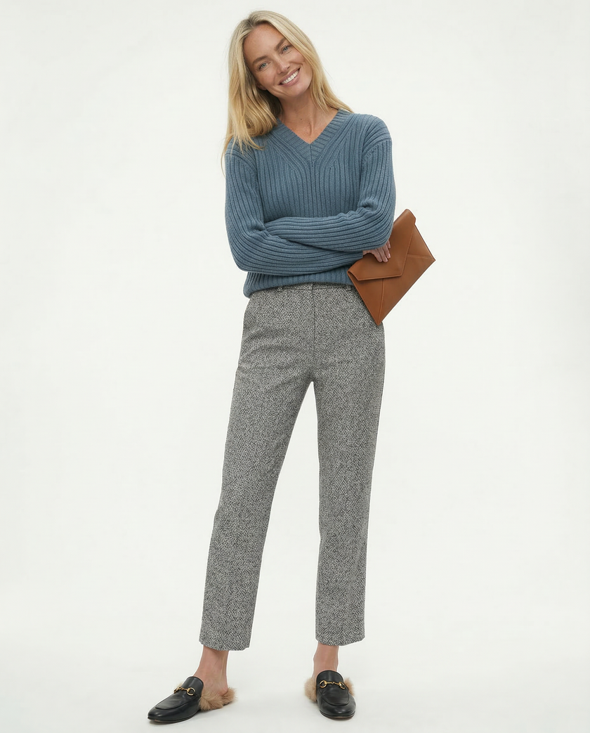 FJØRNA women's wool blend trousers showing tailored fit and classic design in neutral color, suitable for casual or office wear.