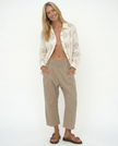 FJØRNA women's wide-leg denim trousers with high waist and relaxed fit, styled with pockets and stitching details.