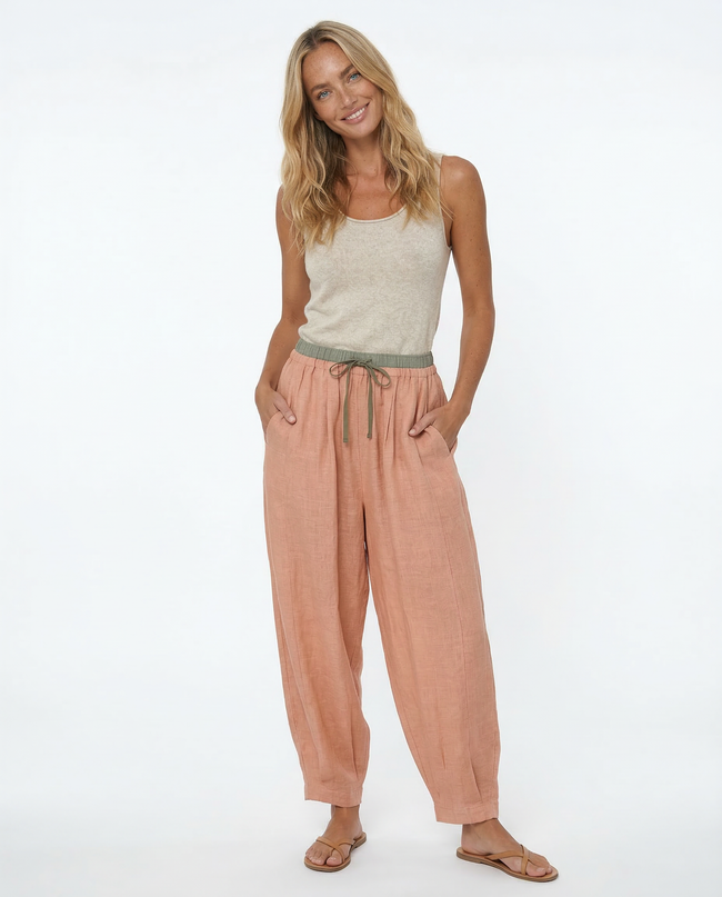 FJØRNA women's linen tapered trousers with a relaxed fit, showcasing lightweight fabric and stylish design for casual wear.