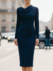 Navy FJØRNA draped midi dress with flowing fabric and elegant silhouette, stylish and suitable for various occasions.