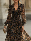 FJØRNA leopard print wrap midi dress with long sleeves, showing a stylish dress with a fitted waist and flowing skirt.