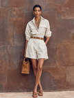 FJØRNA cotton-linen women's jumpsuit with lapel collar, long sleeves, and button-down front, styled as pants with a relaxed fit.