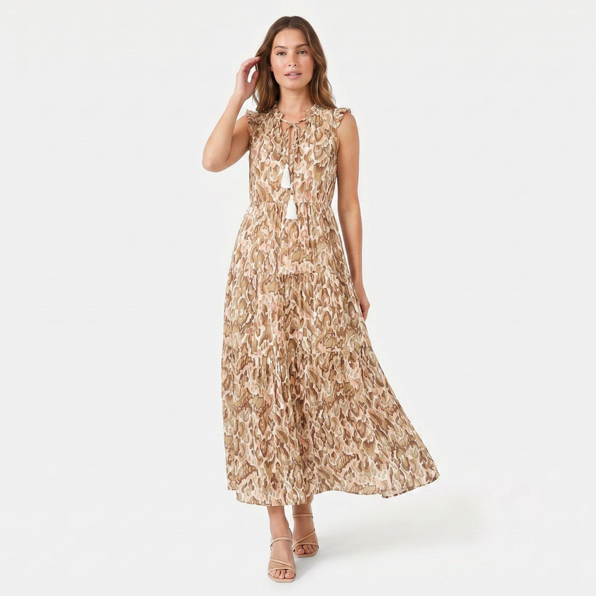 Women's sleeveless floral print boho maxi dress with tie neck by FJØRNA, featuring a flowy silhouette and vibrant pattern.