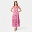 Women's sleeveless floral print boho maxi dress with tie neck from FJØRNA, featuring a flowing silhouette and vibrant pattern.