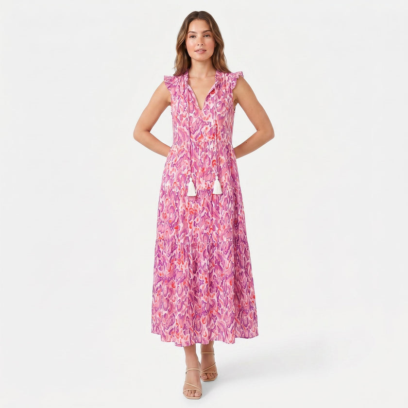 Women's sleeveless floral print boho maxi dress with tie neck from FJØRNA, featuring a flowing silhouette and vibrant pattern.