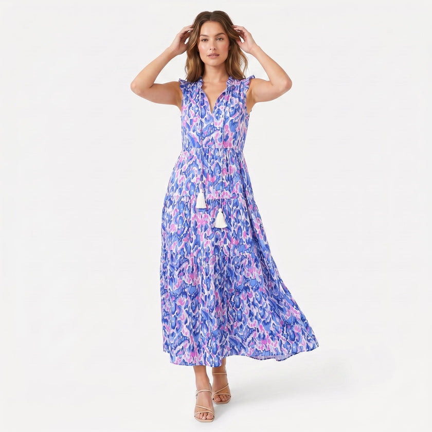 Women's sleeveless floral print boho maxi dress with tie neck from FJØRNA, featuring a flowing silhouette and vibrant floral pattern.