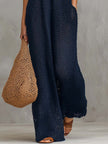 Navy boho knitted sleeveless jumpsuit for women by FJØRNA, featuring a relaxed fit and stylish casual design.