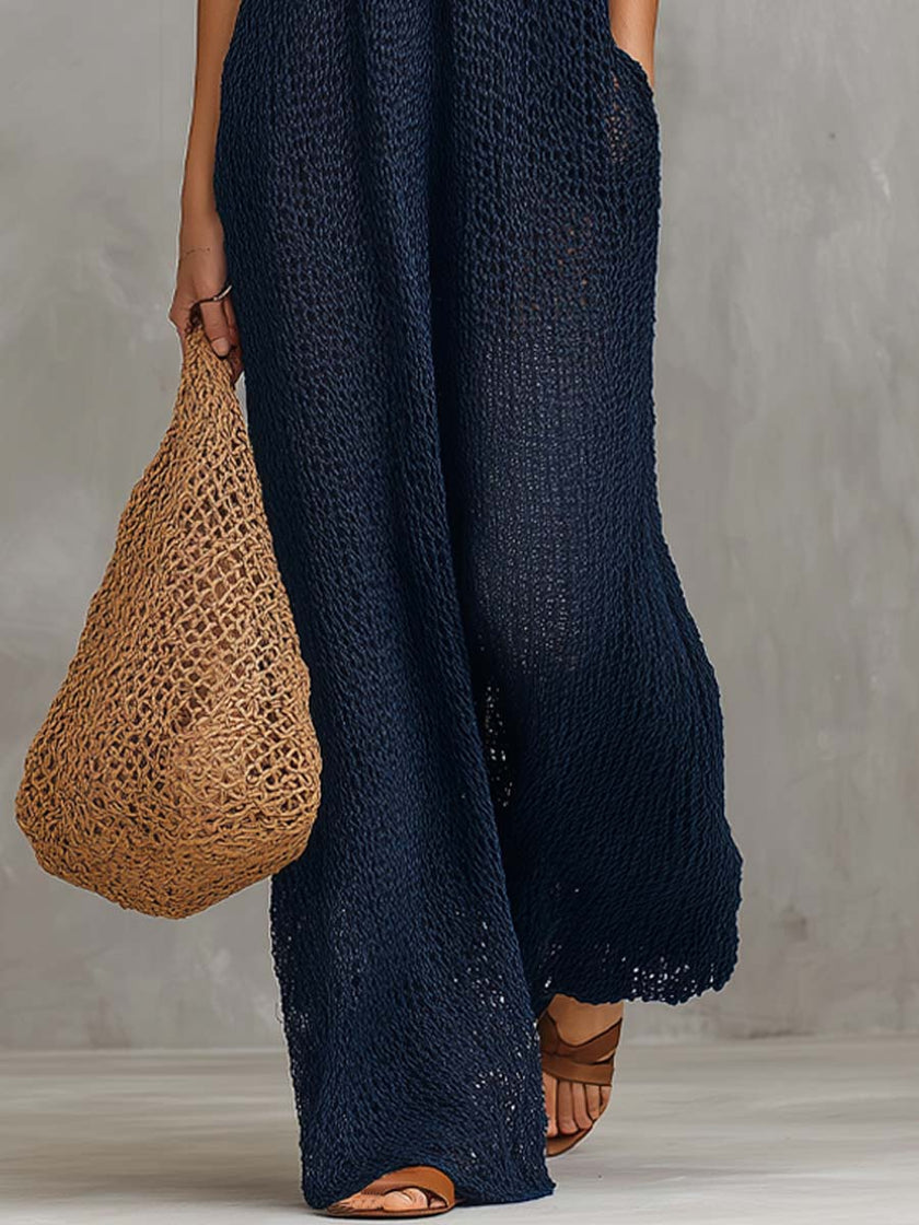 Navy boho knitted sleeveless jumpsuit for women by FJØRNA, featuring a relaxed fit and stylish casual design.
