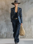 Black faux leather blazer with tassel details and notch lapel by FJØRNA, featuring a stylish tailored fit.
