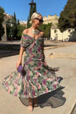 FJØRNA elegant white maxi dress with a V-neck and fantasy floral painted print, perfect for parties and special occasions.