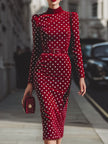 Vintage-inspired red polka dot velvet midi dress for women by FJØRNA, featuring a classic silhouette and elegant design.