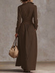 FJØRNA high waisted maxi dress with long sleeves, button detail, pleated pockets, split-joint lapel in solid color