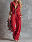 Raspberry red cotton hooded zip-front jumpsuit by FJØRNA, casual and comfortable with a front zipper and hood design.