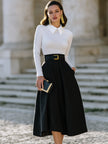 FJØRNA pleated A-line midi skirt with statement buckle belt, stylish midi dress for women, showcasing the skirt's flowy fabric and belt detail.