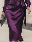 FJØRNA deep purple satin wrap midi dress for women, featuring elegant long sleeves and a fitted silhouette.