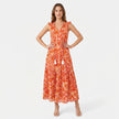 Women's sleeveless floral print boho maxi dress with tie neck by FJØRNA, showcasing a flowing design and vibrant pattern.