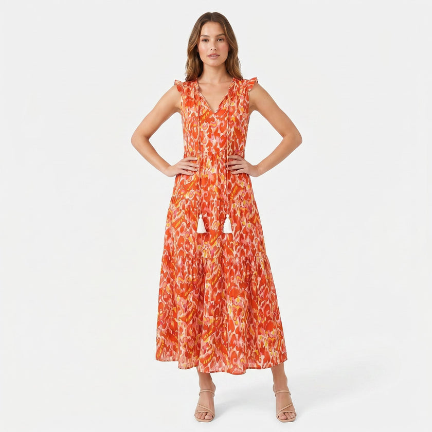 Women's sleeveless floral print boho maxi dress with tie neck by FJØRNA, showcasing a flowing design and vibrant pattern.