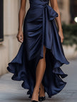 FJØRNA Midnight Elegance satin halter ruffle gown displayed on a hanger, showcasing its flowing fabric and stylish design.