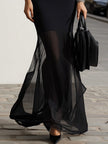 FJØRNA black sheer mesh mermaid maxi dress featuring fitted bodice, flowing skirt, and elegant design for formal occasions.