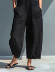 FJØRNA linen blend sleeveless jumpsuit for women with stand collar, button-up front, loose fit, versatile pants style.