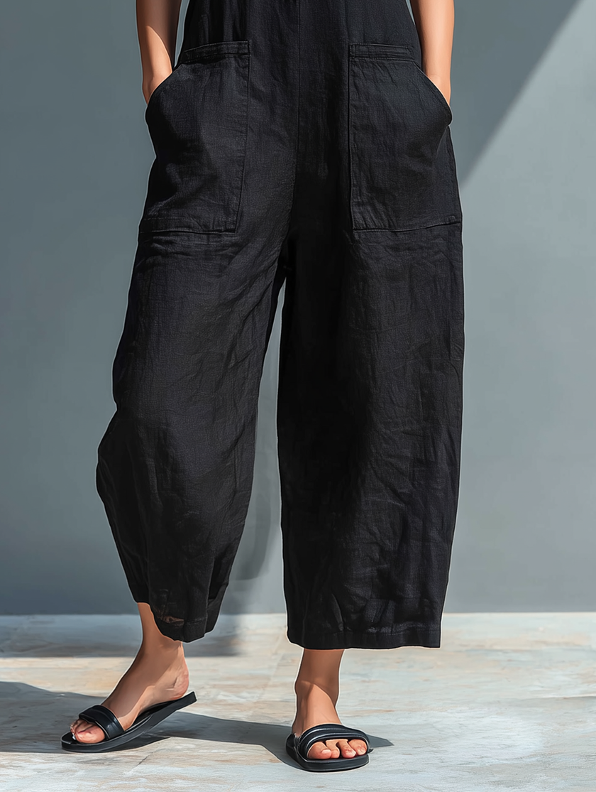 FJØRNA linen blend sleeveless jumpsuit for women with stand collar, button-up front, loose fit, versatile pants style.