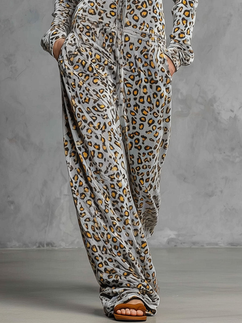 Grey velvet leopard print hooded wide-leg jumpsuit by FJØRNA, featuring a relaxed fit and stylish design.
