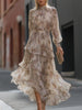 FJØRNA high neck tiered floral maxi dress featuring a flowing silhouette and vibrant floral pattern.