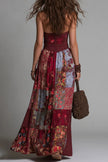 FJØRNA printed sleeveless V-neck maxi dress with fitted waist, casual style, and vibrant pattern, perfect for summer wear.