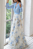 FJØRNA plant print V-neck long sleeve maxi dress with elegant stitching, flowing fabric, and floral design.