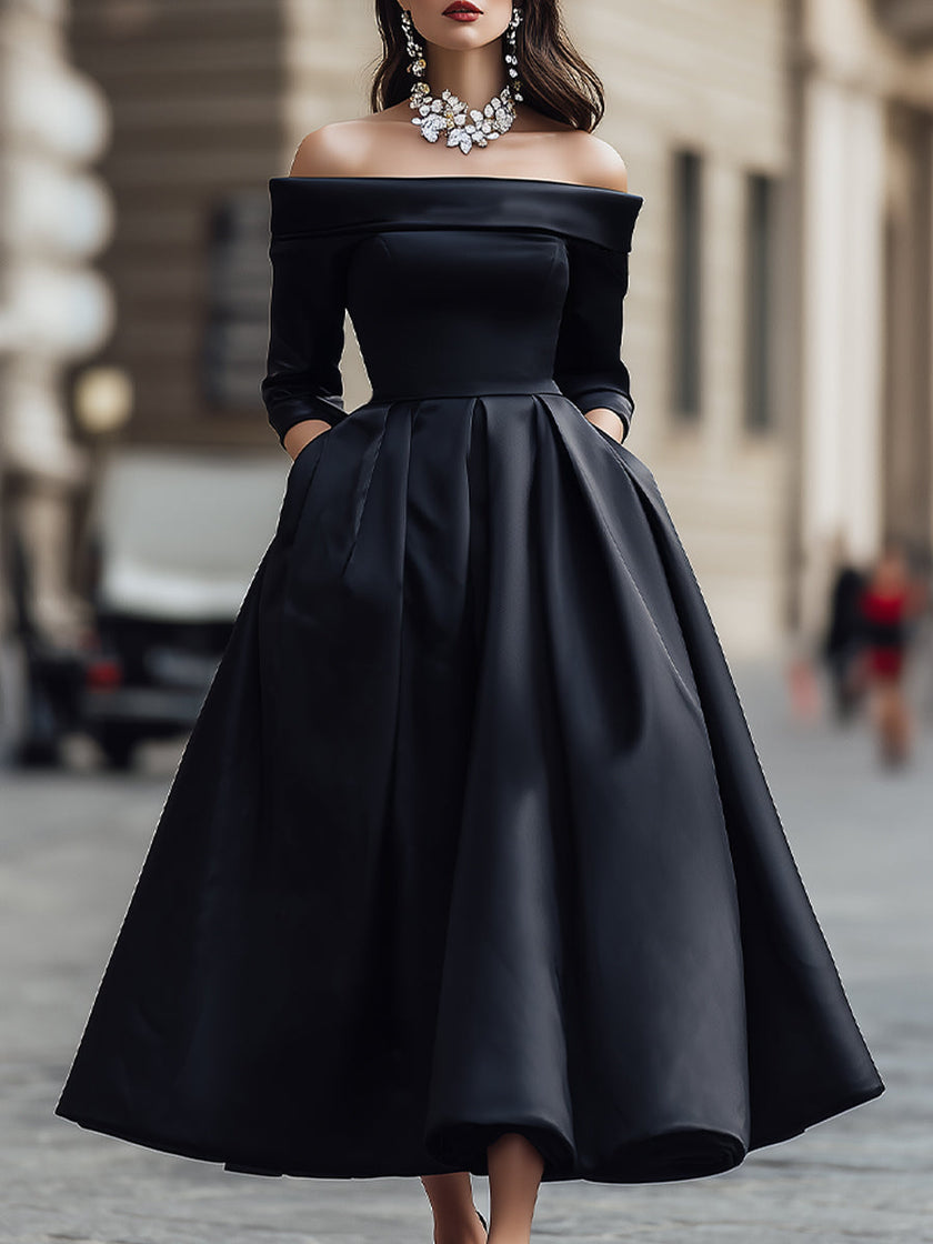 Elegant FJØRNA off-shoulder satin midi dress displayed on a hanger, showcasing its smooth fabric and stylish neckline.