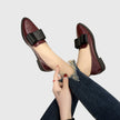 FJØRNA women's orthopedic loafers with slip-on design, arch support, and cushioned comfort, showing the stylish black leather upper.