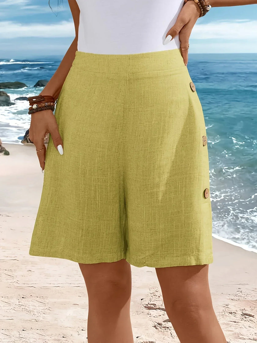 FJØRNA lightweight summer women's shorts with relaxed fit and elastic waistband, made of breathable fabric, shown on a model.