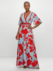 FJØRNA women's elegant floral maxi dress with short sleeves, flowing fabric, and a stylish, feminine design.