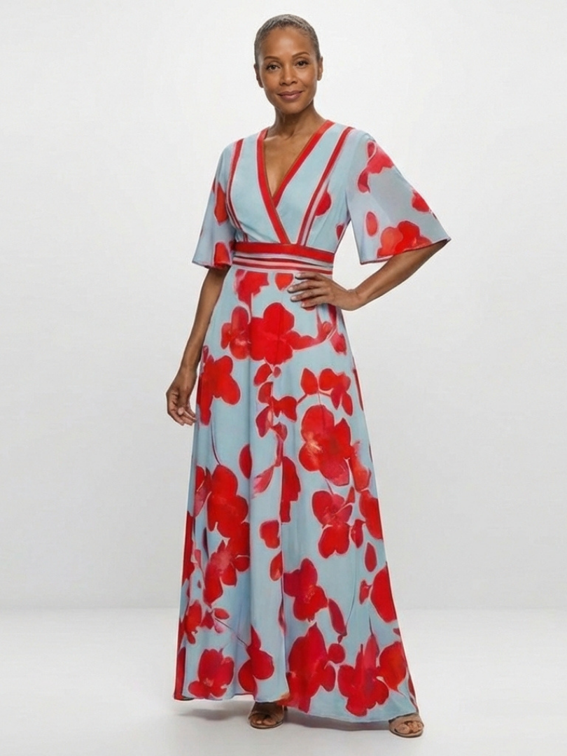 FJØRNA women's elegant floral maxi dress with short sleeves, flowing fabric, and a stylish, feminine design.