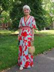 FJØRNA elegant floral maxi dress for women with short sleeves, flowing fabric, perfect for summer or special occasions.