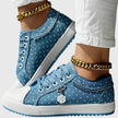FJØRNA Elyana™ orthopedic sneakers featuring supportive design and casual style in gray with white soles.