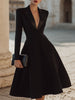 FJØRNA deep V tuxedo-inspired midi dress featuring sleek black fabric and tailored fit, perfect for formal occasions.