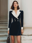 FJØRNA black velvet blazer dress with contrast lapel, double-breasted front, and fitted silhouette, styled for a sophisticated look.